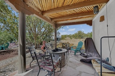 Explore this custom pueblo home with an open floor plan! Light - photo 44
