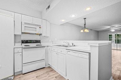 Welcome to this charming, updated 2-bedroom, 2-bathoom condo - photo 6