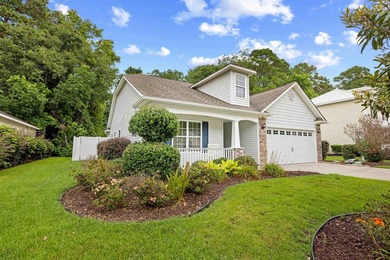 This 3 bed/2 bath charming coastal cottage is nestled within The - photo 1