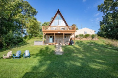 This three-bedroom, two-bath, 2,220-square-foot A-frame home - Lake Home For Sale in Jones, Michigan