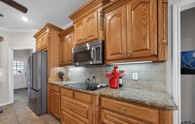 This beautifully maintained 4-bedroom, 2-bath traditional brick - photo 3