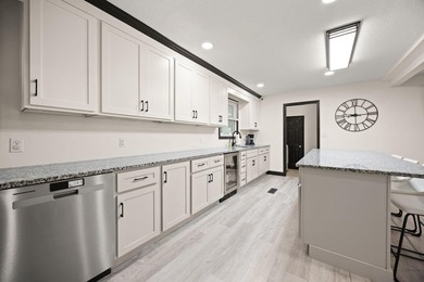 Welcome to this beautifully remodeled 4-bedroom, 1 full and 1 - photo 12