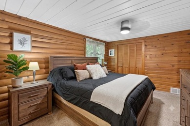 Nestled in the woods on 1.2 acres, this charming partial log - photo 18