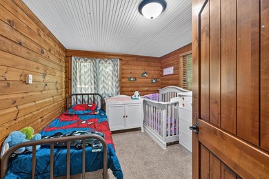 Nestled in the woods on 1.2 acres, this charming partial log - photo 21
