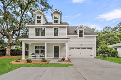 Located on a beautiful homesite of over a quarter acre in the - photo 1