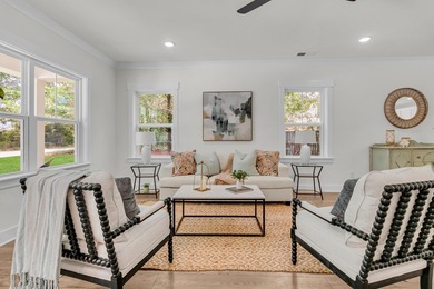 Located on a beautiful homesite of over a quarter acre in the - photo 3