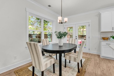 Located on a beautiful homesite of over a quarter acre in the - photo 6