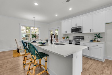 Located on a beautiful homesite of over a quarter acre in the - photo 7