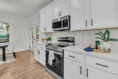 Located on a beautiful homesite of over a quarter acre in the - photo 8