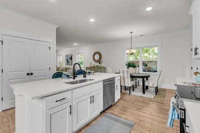 Located on a beautiful homesite of over a quarter acre in the - photo 9