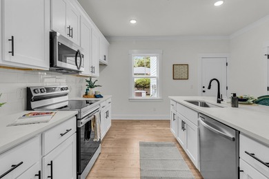 Located on a beautiful homesite of over a quarter acre in the - photo 10