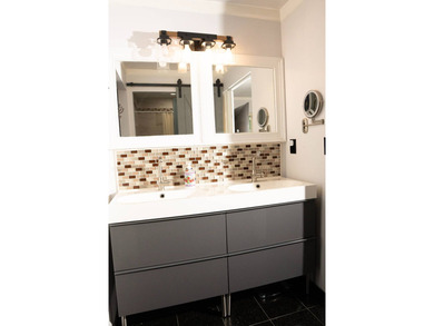 This charming three-bedroom, two-bathroom house offers a unique - photo 14