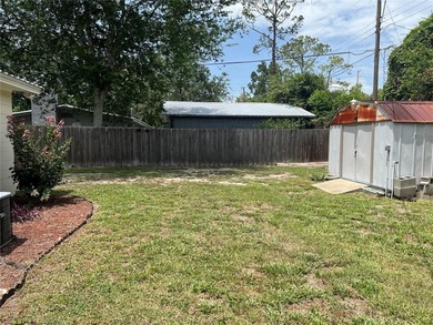 Welcome home to this charming 4-bedroom, 2-bath concrete block - photo 26