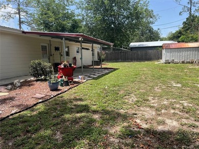 Welcome home to this charming 4-bedroom, 2-bath concrete block - photo 27