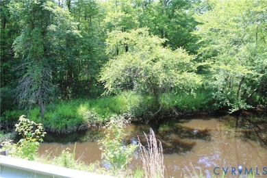 One acre waterfront lot with 448' road frontage along Wilcox - photo 1