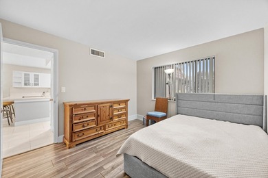 Wake up to tranquil lake and golf course views in this - photo 17