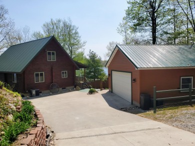 HOPKINS LAKE LOG HOME! - Lake Home For Sale in Ludington, Michigan