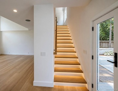 Set on 1.25 professionally landscaped acres bordering protected - photo 13