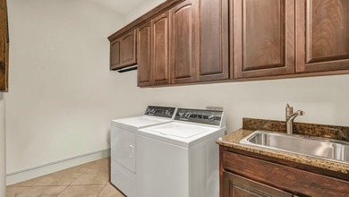 Step into this beautiful 4-bedroom home and instantly feel the - photo 23