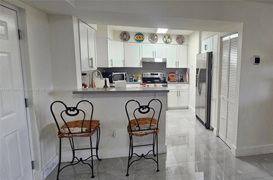 This completely remodeled 3-beds, 2-baths condo offers an