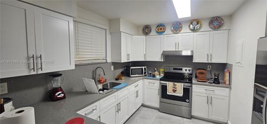 This completely remodeled 3-beds, 2-baths condo offers an