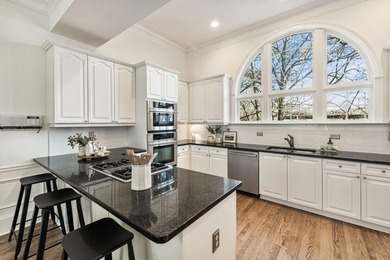 This highly appointed and updated Druid Hills townhome with