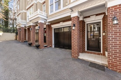 This highly appointed and updated Druid Hills townhome with
