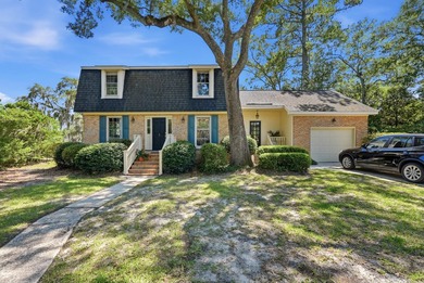 Tucked beneath a canopy of magnificent live oaks in Charleston's - photo 1