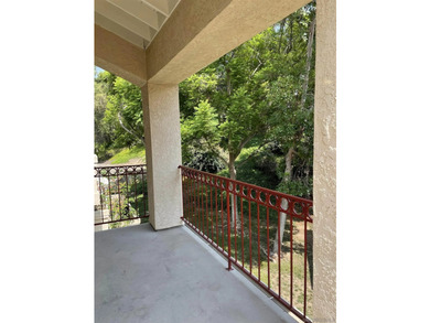 End unit in a private and quiet location overlooking trees in - photo 10