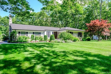 Nestled on two private, professionally landscaped acres in the - photo 3