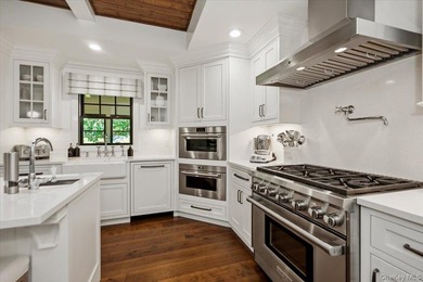Nestled on two private, professionally landscaped acres in the - photo 8