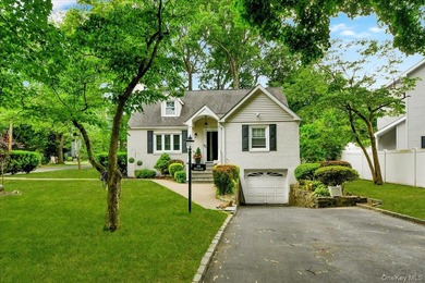 WELCOME HOME!! This charming brick Cape Cod with - photo 1