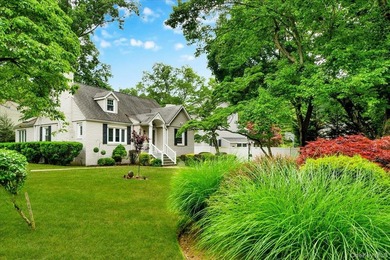 WELCOME HOME!! This charming brick Cape Cod with - photo 3