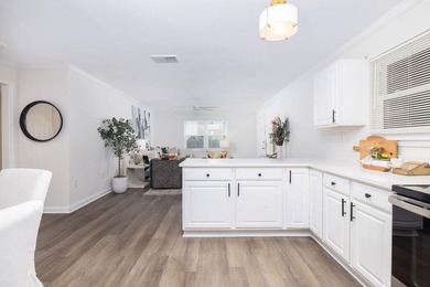 Beautifully updated and move-in ready, this charming condo is - photo 1