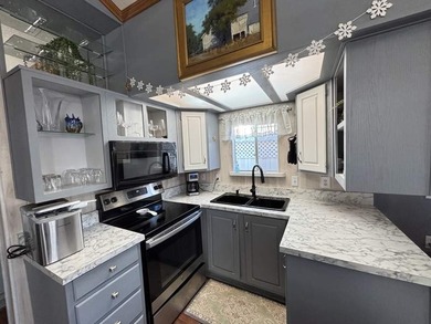 As you enter this beautiful well maintained home, you notice the