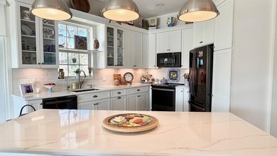 This stunningly renovated home offers modern luxury and peace of - photo 12