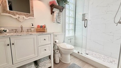 This stunningly renovated home offers modern luxury and peace of - photo 19