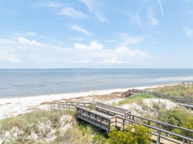 Experience beachfront living like no other at this