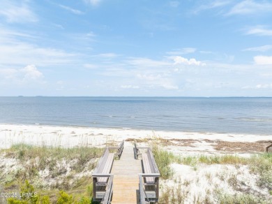 Experience beachfront living like no other at this