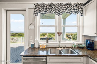 Experience beachfront living like no other at this