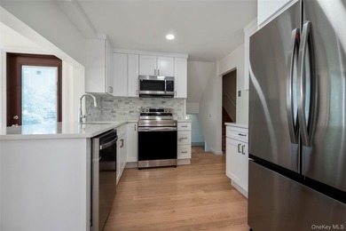 Welcome to this beautifully updated expanded split nestled in - photo 2