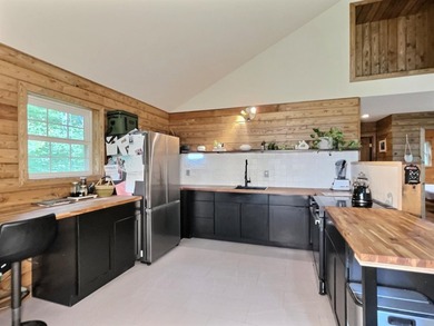 Fantastic log-sided year-round cottage tucked away on 24 private - photo 8