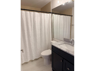 UPDATED 2ND FLOOR CONDO FEATURING WHITE EAT-IN KITCHEN WITH NEW - photo 15