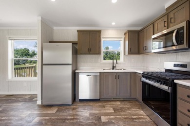 Welcome to easy, worry-free living in this brand-new 2-bedroom - photo 16
