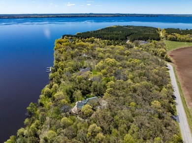 Sweeping lake views in this custom log retreat designed for - photo 2