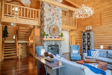 Sweeping lake views in this custom log retreat designed for - photo 4