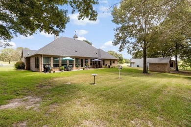 This fully custom, full-brick home sits on just under an acre in - photo 27