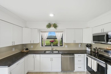 Discover this two-bedroom, two-bath end unit in Quail Meadows at - photo 13