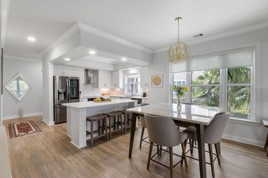 This completely renovated 3-bedroom, 3-bath, corner-unit - photo 3
