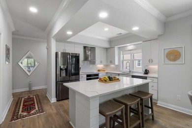 This completely renovated 3-bedroom, 3-bath, corner-unit - photo 6
